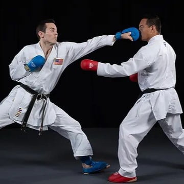 Karate student striking his opponent